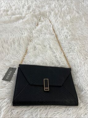 Guess clutch bag, with removable chain strap.